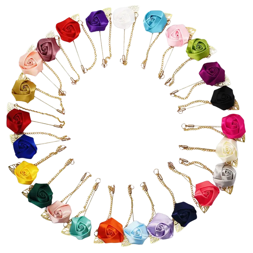 A collection of colorful satin rose pin brooches with gold-toned chains and leaf accents including burgundy rose boutonniere