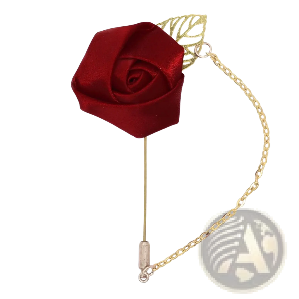 A burgundy rose boutonniere featuring a deep red satin pin with a gold-toned leaf accent and chain attachment