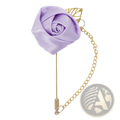 A burgundy rose boutonniere featuring a delicate lavender satin rose pin with gold-toned leaf accent and chain