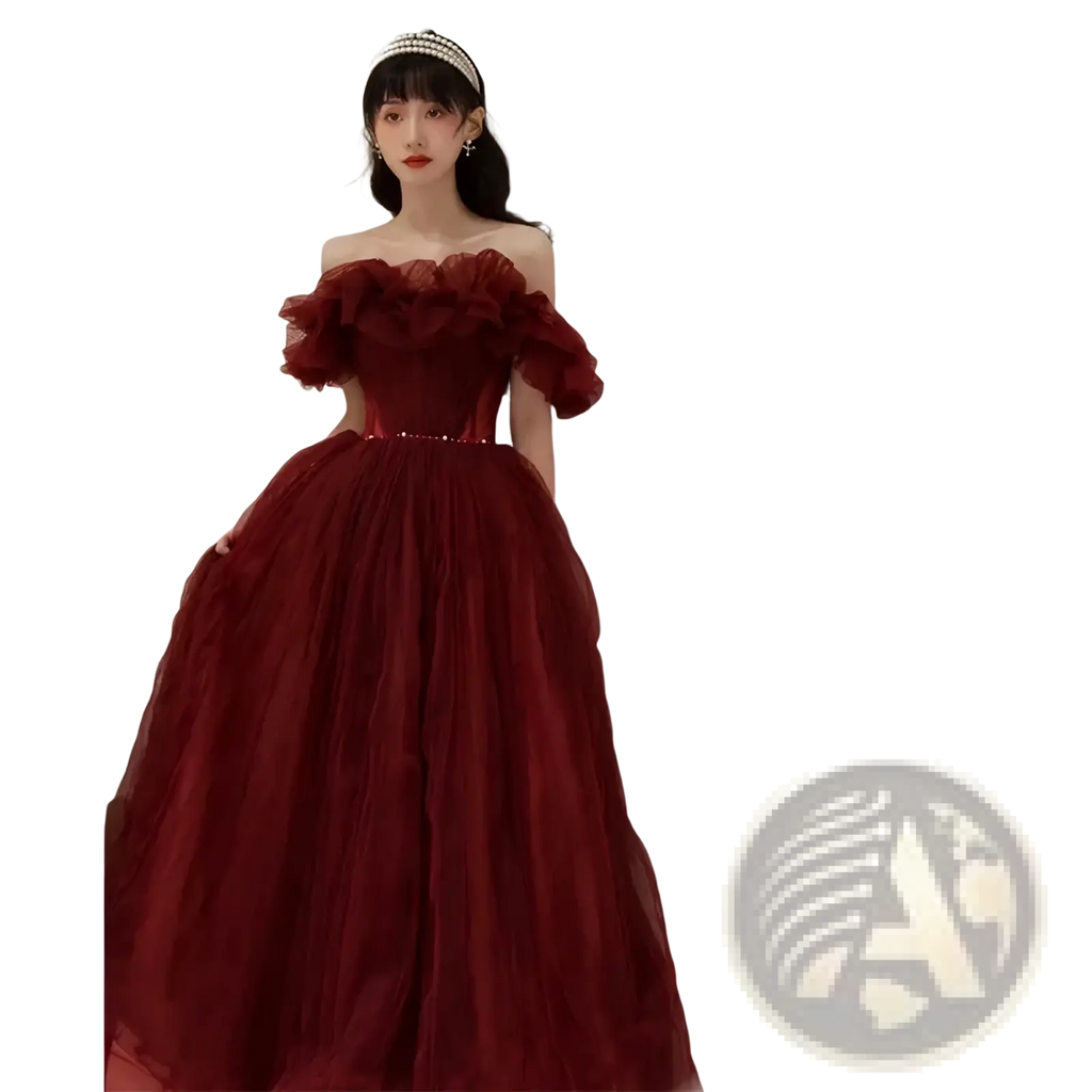 A deep red off the shoulder tulle prom ball gown with ruffled sleeves and a beaded waistband