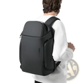 Black ergonomic business backpack with sleek matte finish and subtle logo designed for 15.6 inch laptops waterproof material