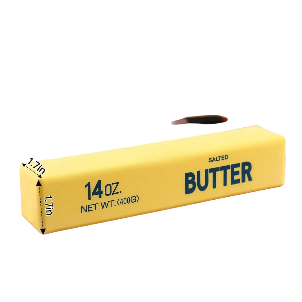 A yellow rectangular butter slow rising squishy fidget toy with blue lettering and soft rubber texture