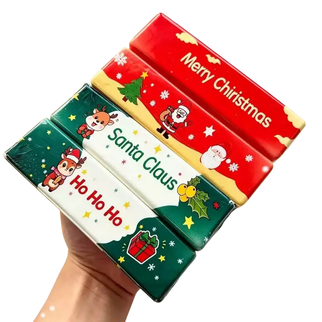 Three colorful christmas-themed butter squishy toy tissue boxes with santa claus and reindeer slow rising design