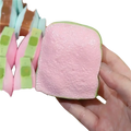 Pink and green silicone squishy toy shaped like a bread slice butter stick asmr sensory squishy toy