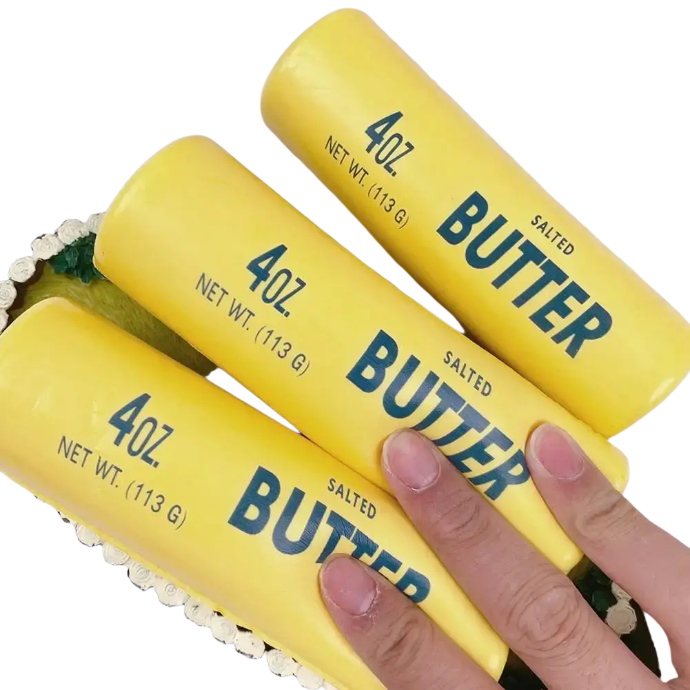 Three bright yellow butter sticks labeled 4oz net wt slow rising squeeze toys for stress relief or play
