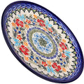 A vibrant 7.5 inch Unikat Butterfly Polish pottery ceramic dessert plate with colorful floral and botanical patterns