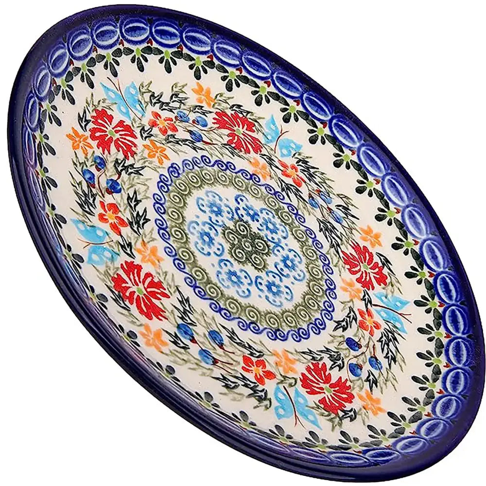 A vibrant 7.5 inch Unikat Butterfly Polish pottery ceramic dessert plate with colorful floral and botanical patterns