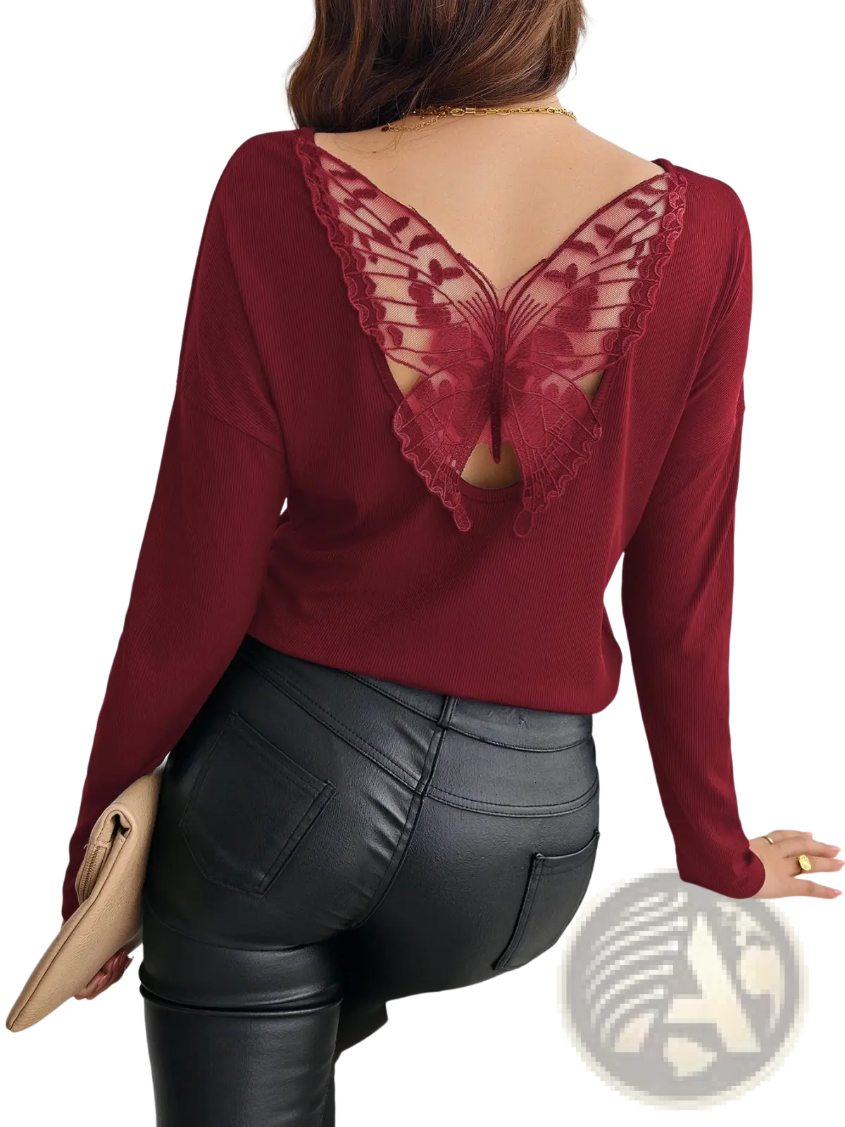 A maroon ribbed long sleeve top shown from the back with a delicate butterfly-shaped lace detail
