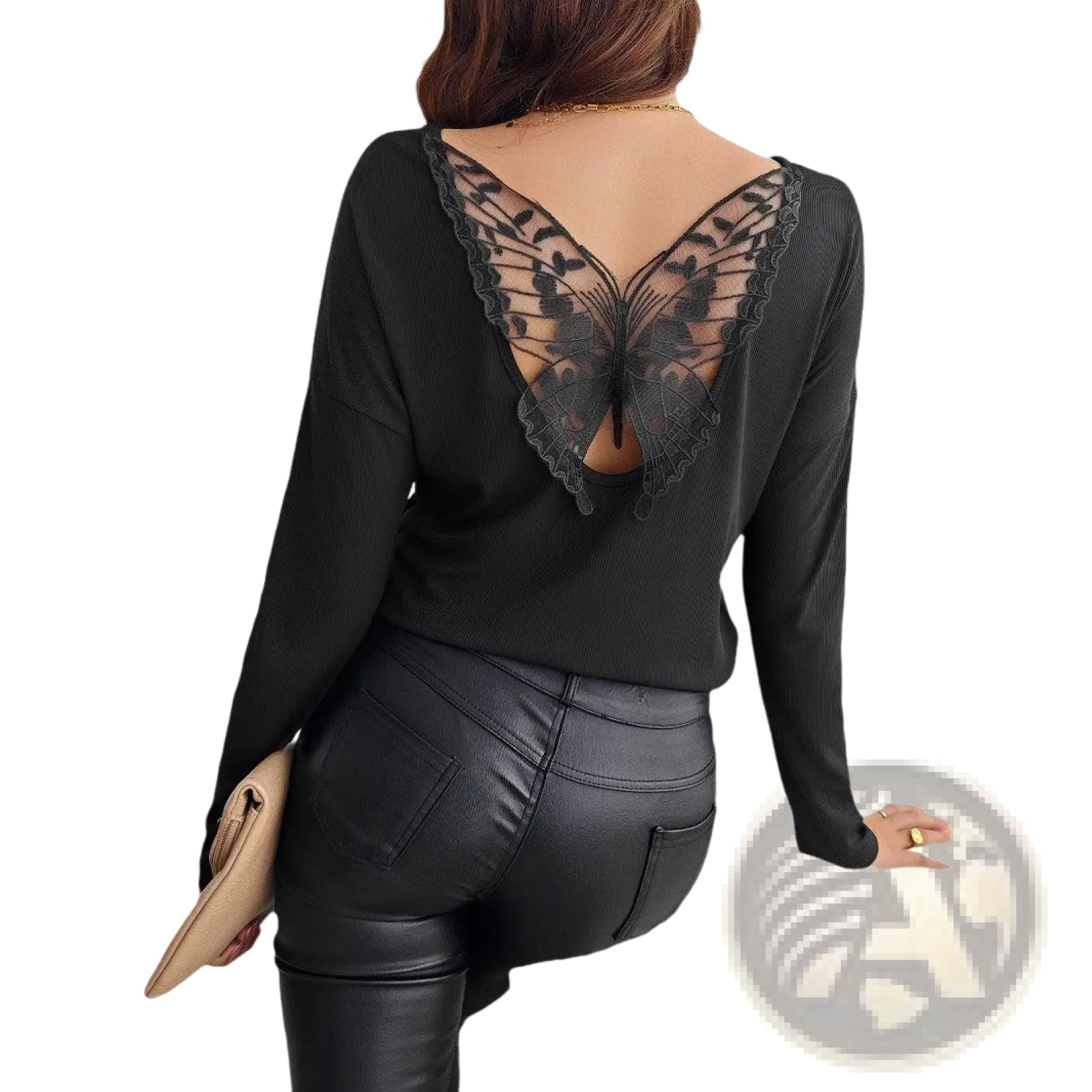 Black long-sleeved ribbed top shown from the back with sheer butterfly lace detail elegant and stylish design