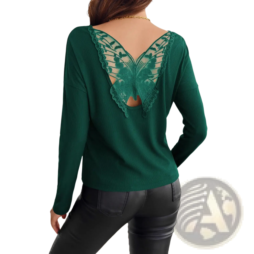 Emerald green ribbed long sleeve knit top shown from the back featuring intricate butterfly lace detail