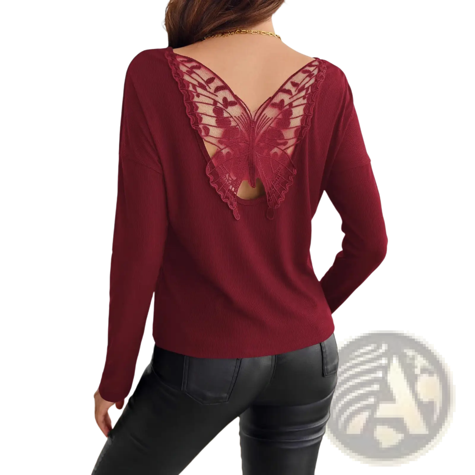 Back view of a maroon ribbed knit long sleeve top featuring an intricate butterfly-shaped lace back detail