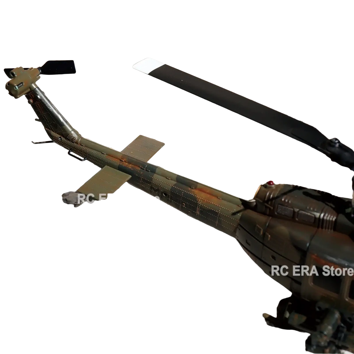 C032 uh1 remote control helicopter featuring camouflage weathered design black rotor blades and metallic finish