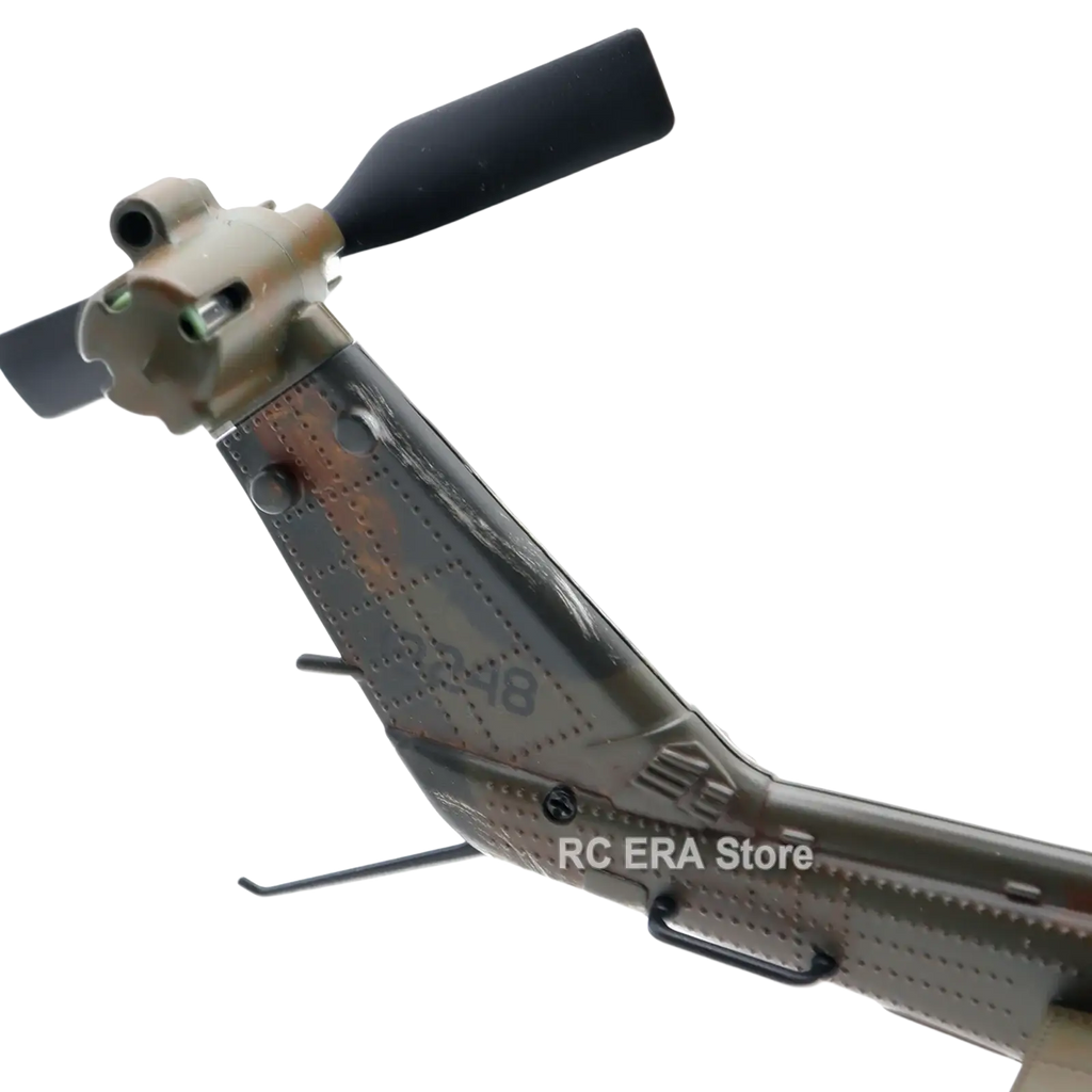 C032 uh1 camouflage weathered remote control helicopter model with black rotor blades and detailed metallic finish