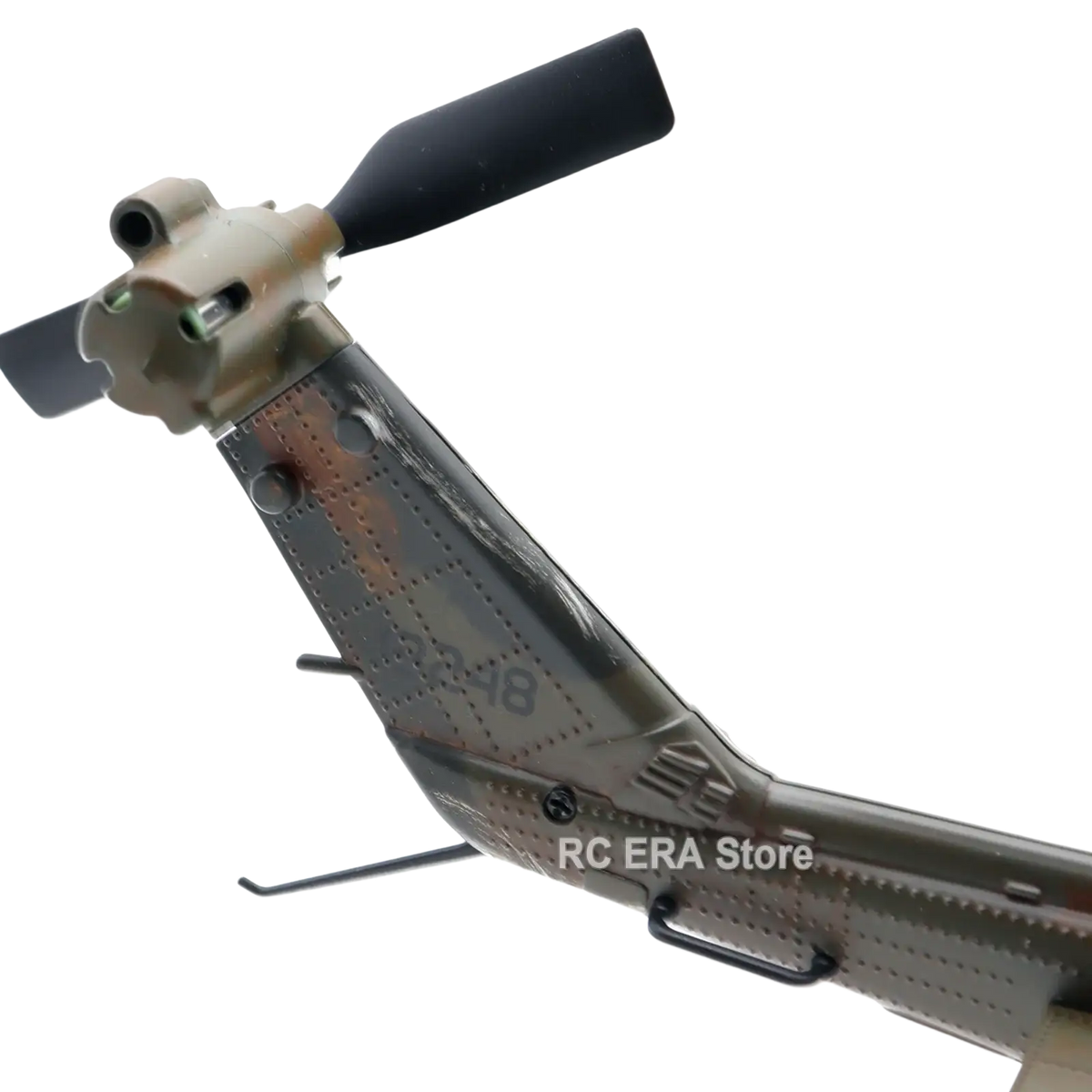C032 uh1 camouflage weathered remote control helicopter model with black rotor blades and detailed metallic finish
