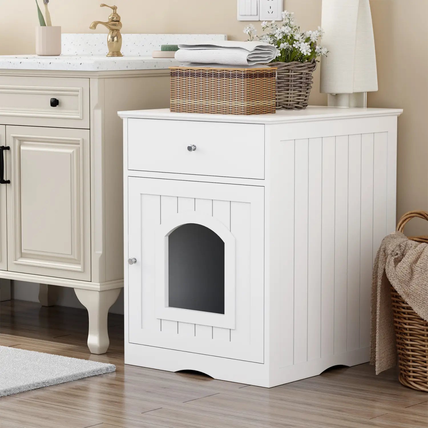 White wooden cat litter box enclosure with vertical paneling, arched door, drawer, and silver knobs.