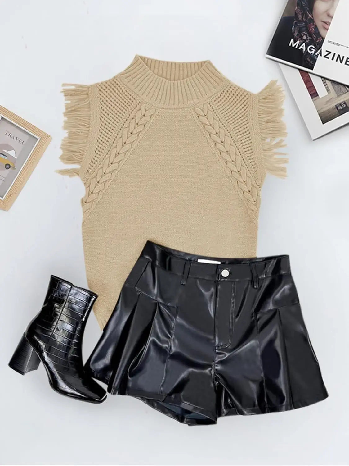 Beige hand-woven fringed sleeveless knit sweater vest featuring frayed shoulder details and a braided pattern across the chest.