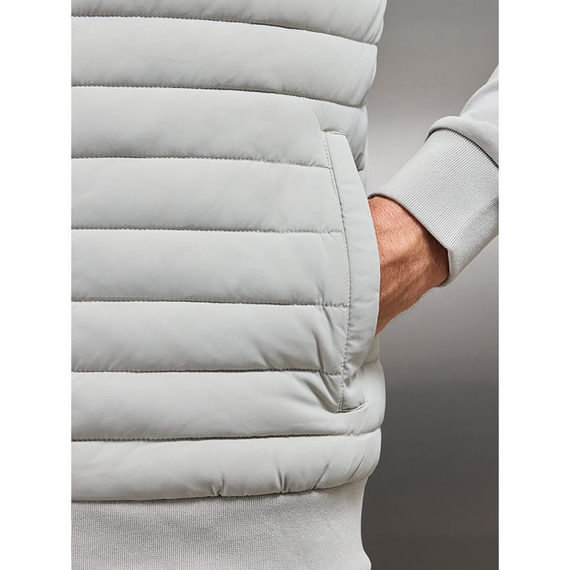 Light gray quilted lightweight puffer vest with horizontal stitching and a side pocket from the men’s quilted lightweight bomber jacket collection featuring a stand collar.