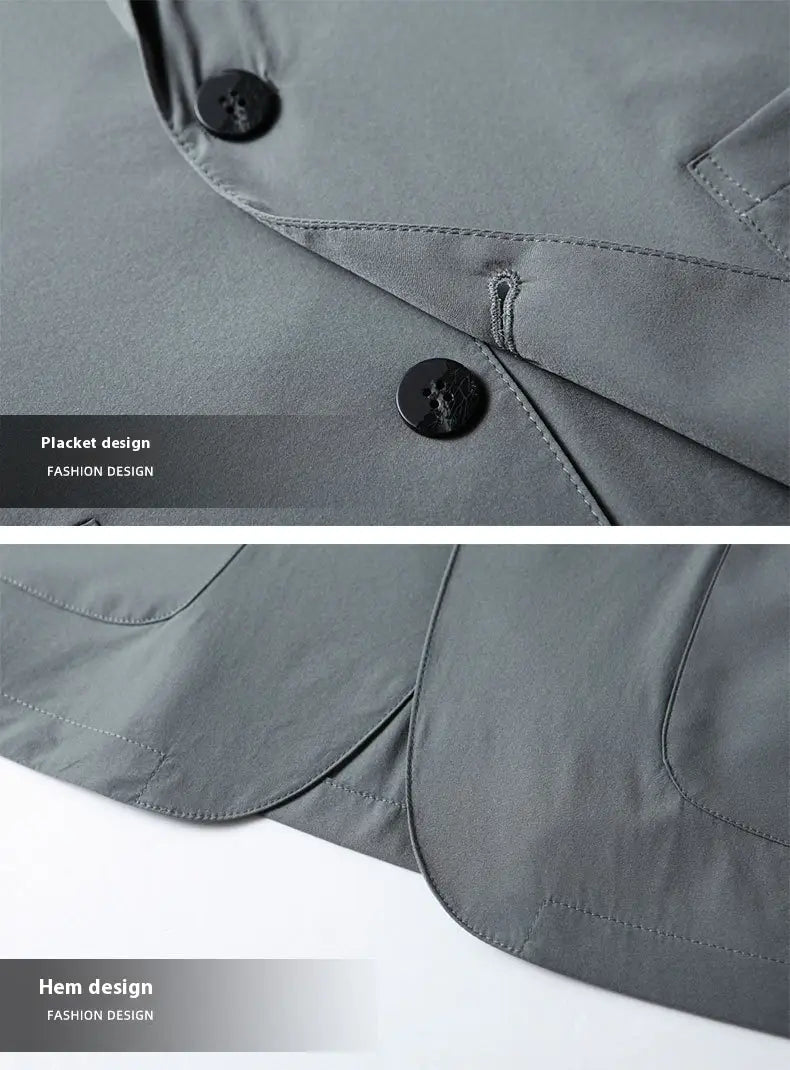 Eine Herren-Leichtgewicht-Stretch-Anzugjacke gegen Falten, dargestellt als grauer Trenchcoat mit schwarzen Knöpfen und einer Plackendesign.
