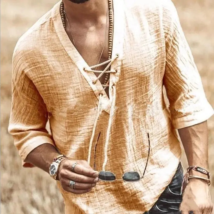 A light beige textured linen shirt featuring a v-neck and lace-up front detail.