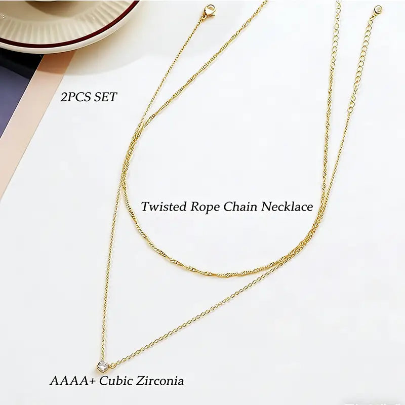 14k gold plated dainty diamond solitaire pendant necklace featuring a gold twisted rope chain with aaaa plus cubic zirconia pendant.