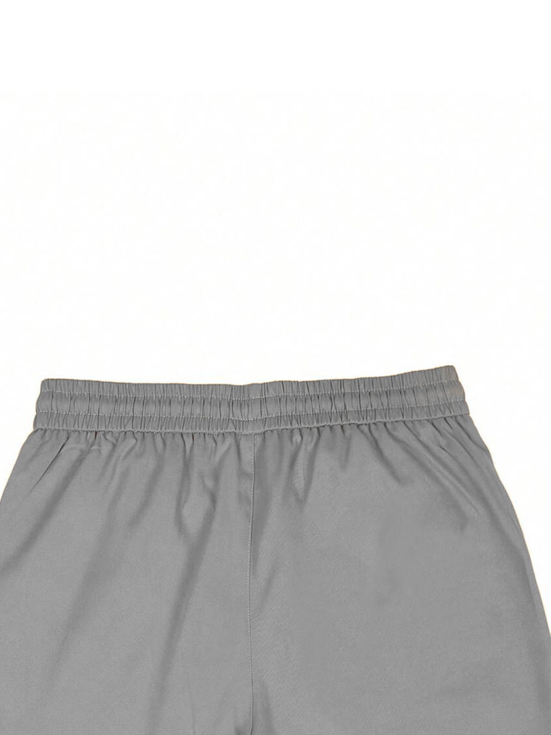 Gray slim fit tapered jogger pants with an elastic waistband and lightweight smooth fabric designed for athletic use.