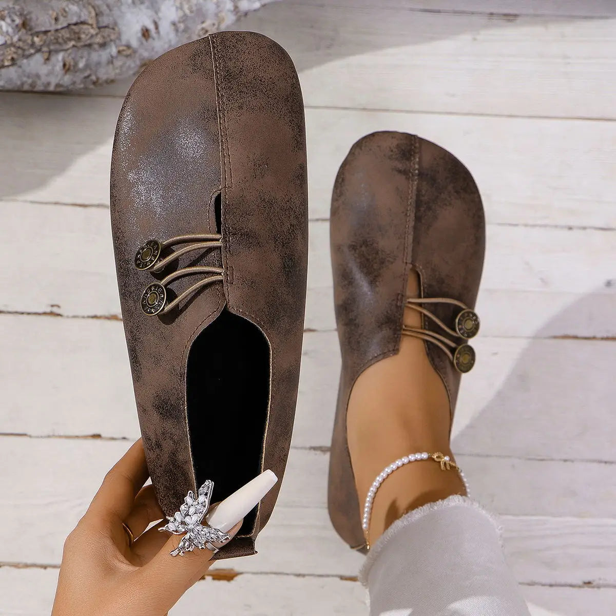 brown suede women’s square toe slip-on loafers with decorative metal buttons and lace-up leather detailing