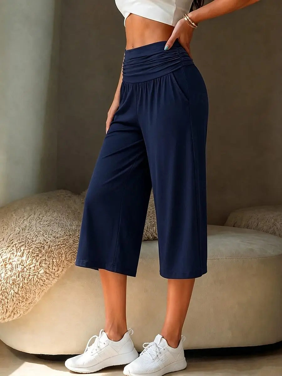 navy blue high-waisted wide-leg cropped pants made from soft fabric designed for casual wear.