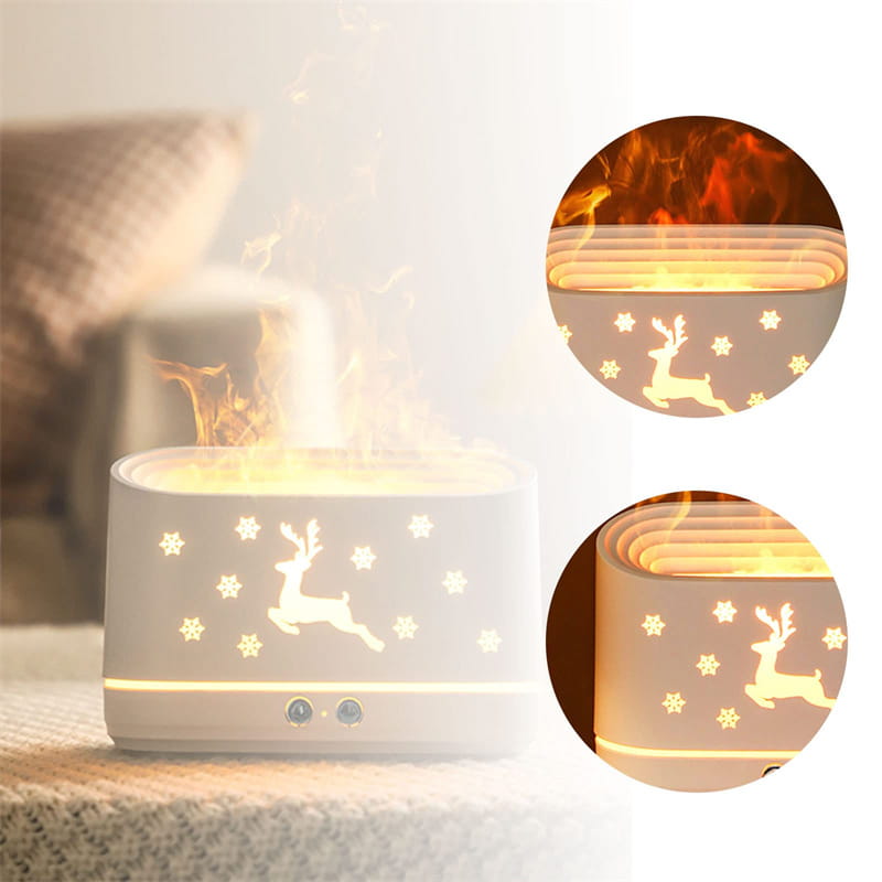 White ceramic elk flame humidifier Christmas oil diffuser with reindeer and snowflake design emitting warm light.