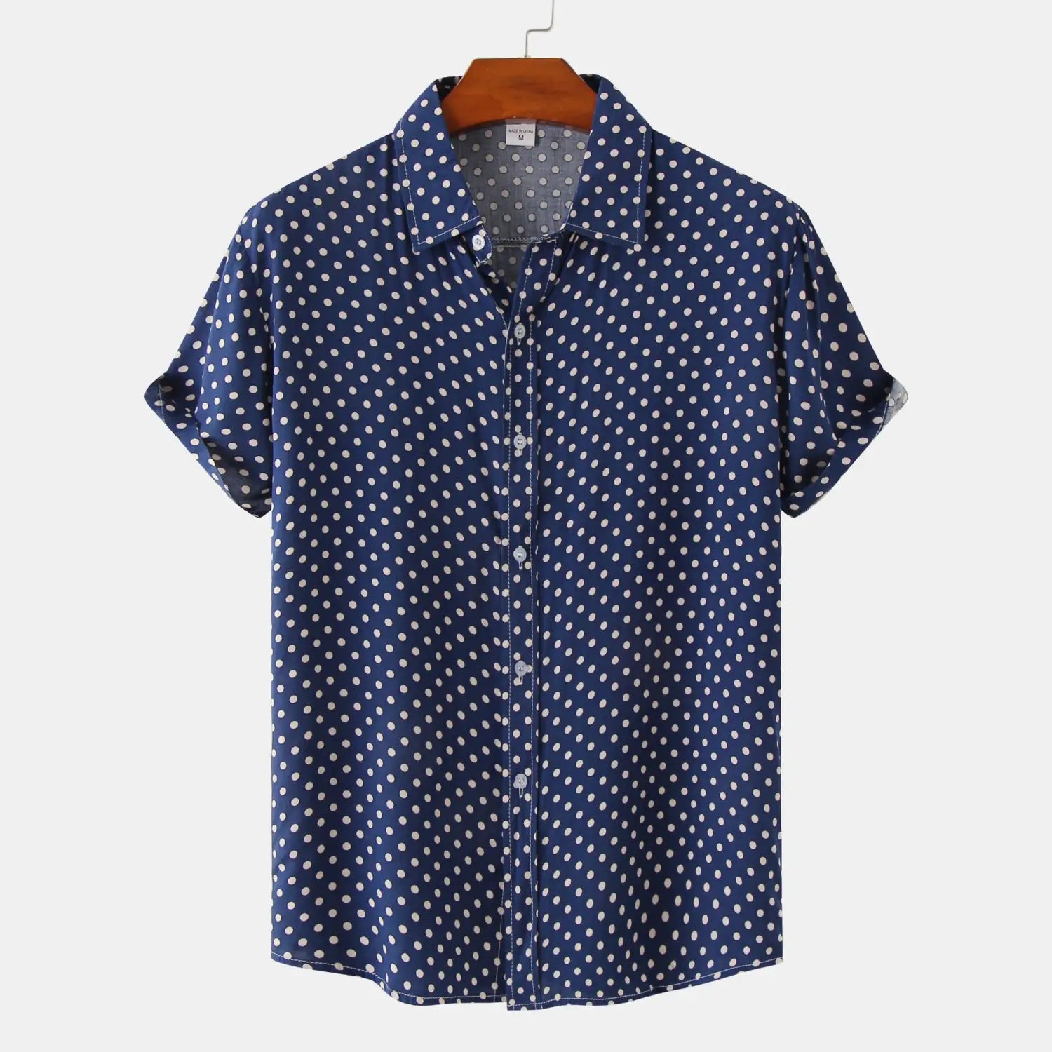 men plus size navy blue short-sleeved button-up shirt with white polka dot pattern hanging on a wooden hanger
