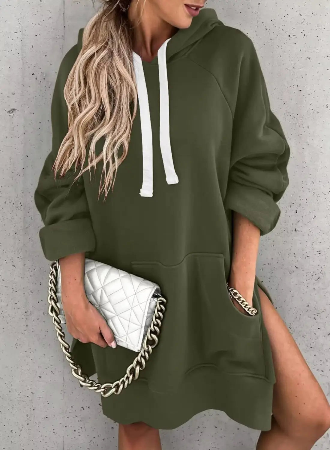 olive green oversized mid length hooded sweatshirt dress with white drawstrings and side pockets made from comfortable material for casual wear