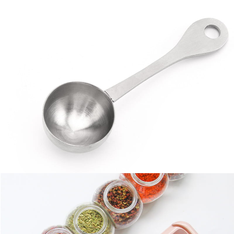 A sleek 304 stainless steel measuring spoon with a polished finish and a hole at the end of the handle for kitchen use.