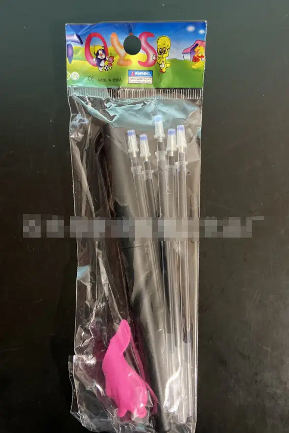 Set of six clear plastic party blow darts with black handles and purple tips packaged in a colorful cartoon-themed bag for the Sank Magic Practice Copybook Set for kids preschoolers.