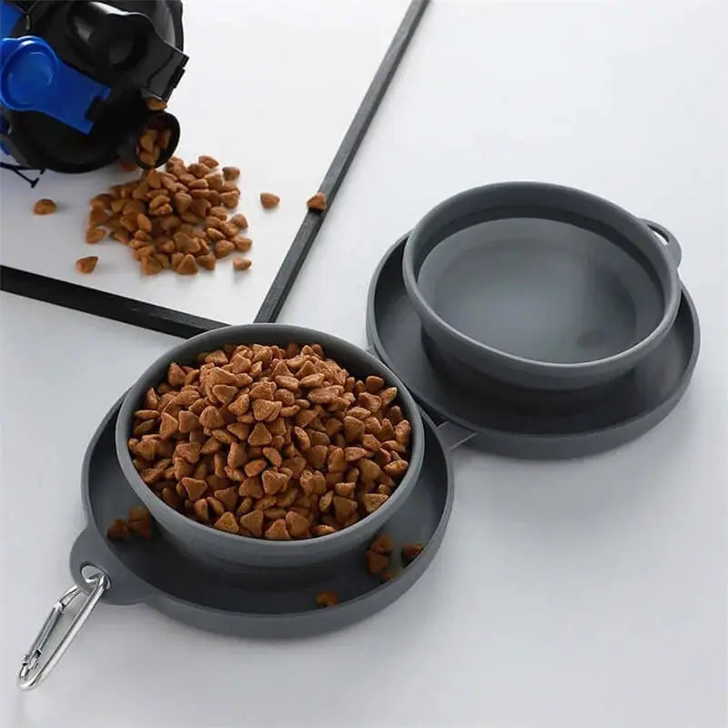 Gray collapsible dog bowl double silicone travel set with a metal carabiner clip for pet food and water.