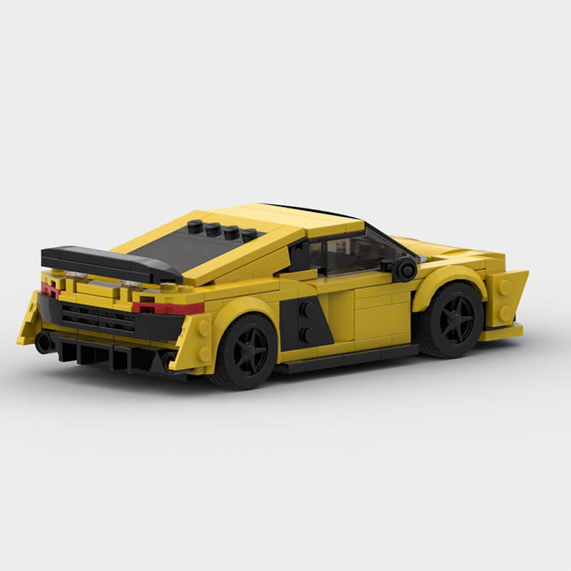 Modelo de automóvil deportivo de lego amarillo y negro con un diseño aerodinámico y elegante del conjunto de modelos educativos de bloques de construcción de automóviles de carreras.