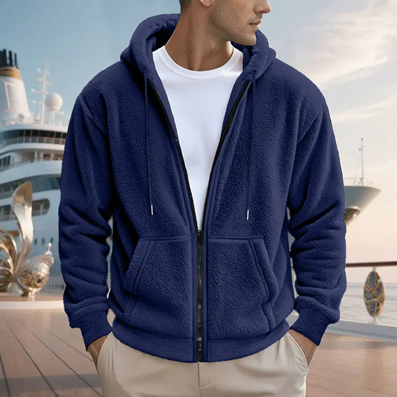 Men’s fleece lined loose zip up hooded jacket in navy blue plush fabric with front pockets and black zipper trim.