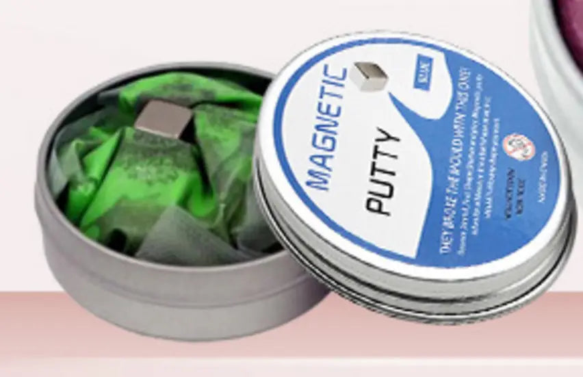 A silver tin container holding green magnetic putty with a blue and white label reading magnetic putty from the Magnetic Putty Stress Relief Toy 6 Color Set.