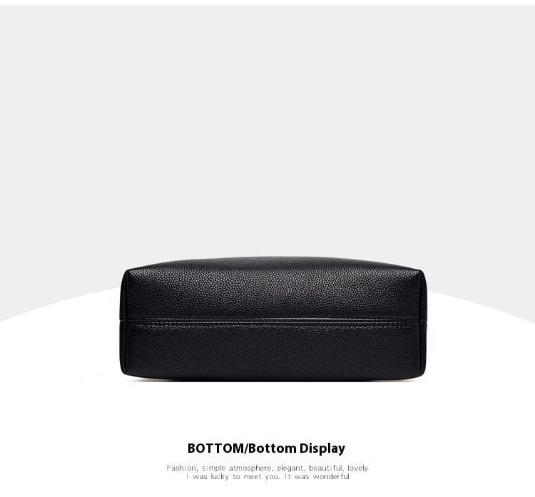 Black textured leather crossbody handbag with a sleek rectangular design and silver chain strap.