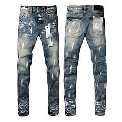 Men’s distressed slim fit patchwork denim jeans in blue with a faded wash and ripped details.