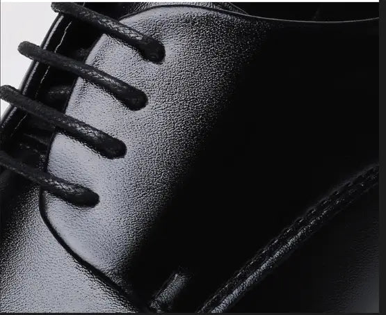Men’s brown leather formal dress shoe featuring black leather with matching laces.