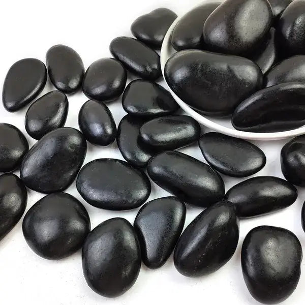 Black smooth polished river rocks 2 to 3 inch pebbles with a glossy finish weighing 38 pounds.