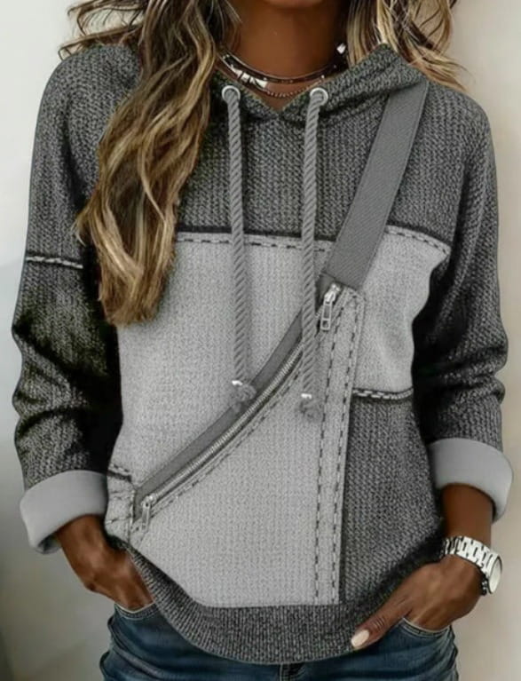 Women 3d patchwork hoodie in gray and light gray knit fabric with a diagonal zipper pocket and matching drawstrings.