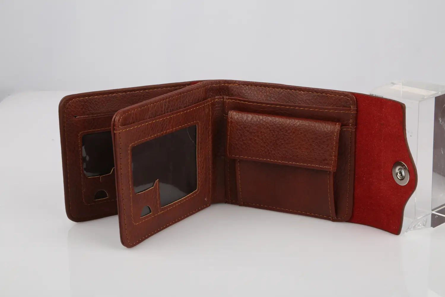 men’s slim rfid blocking brown pu leather bifold wallet featuring red interior lining and silver-toned snap closure.
