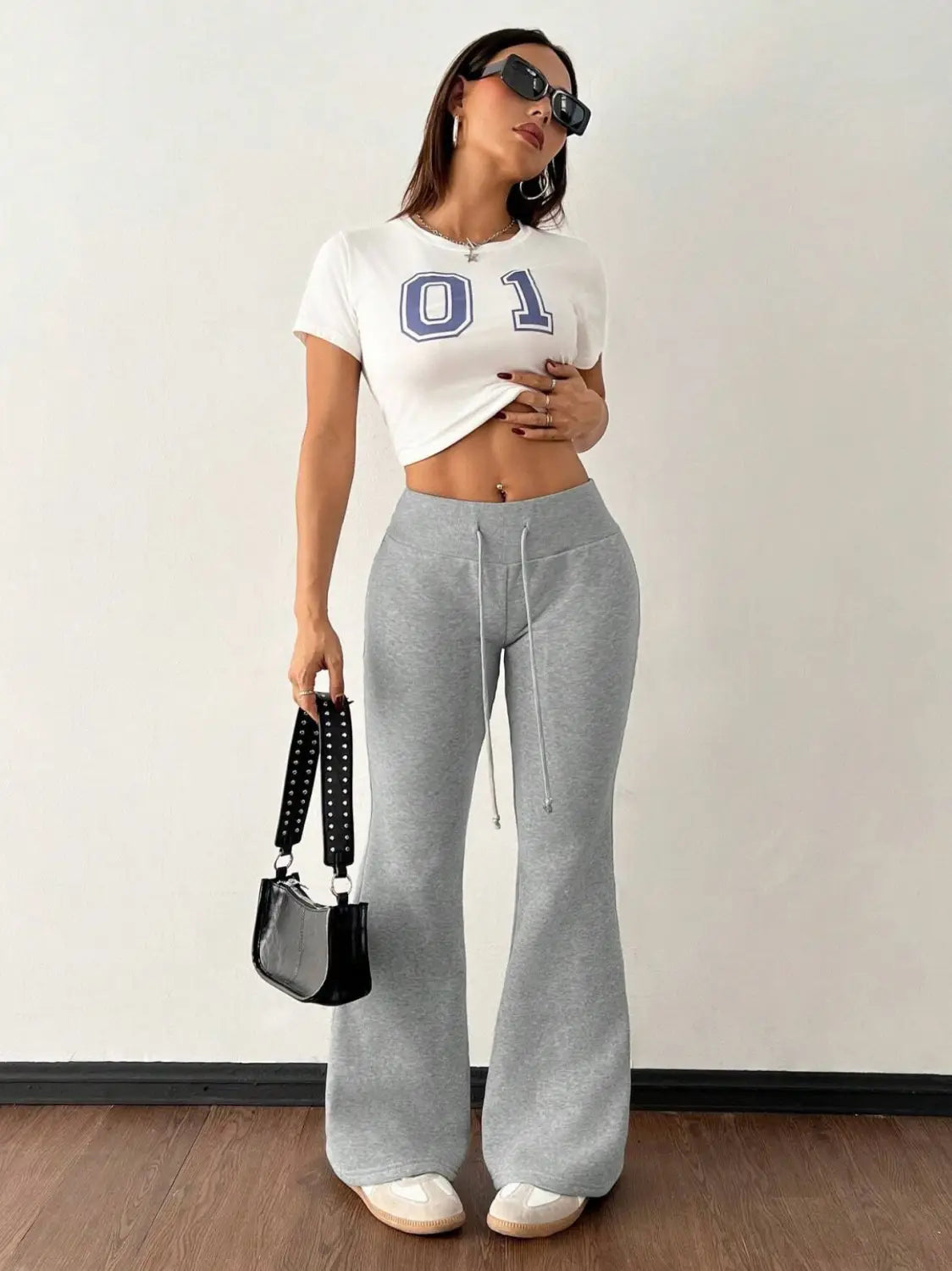 gray fleece lined high waist flared sweatpants with drawstring waistband designed for comfort and warmth