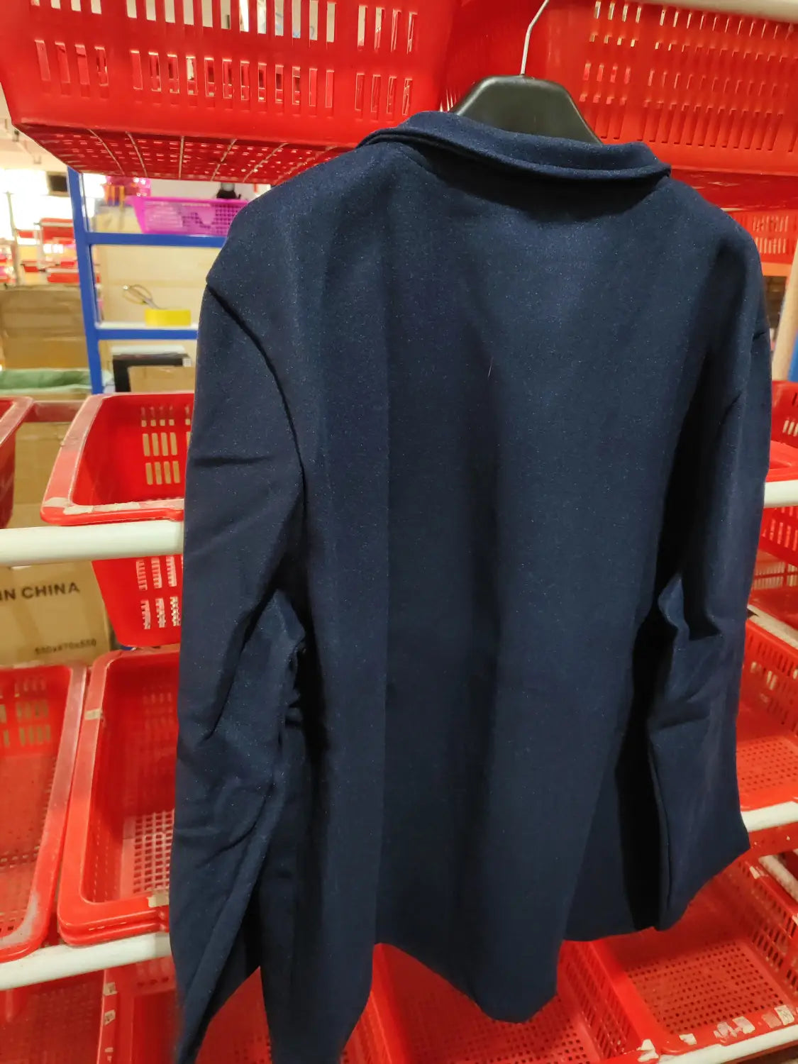 A navy blue woolen men hip hop bomber jacket with a classic collar and tailored fit.