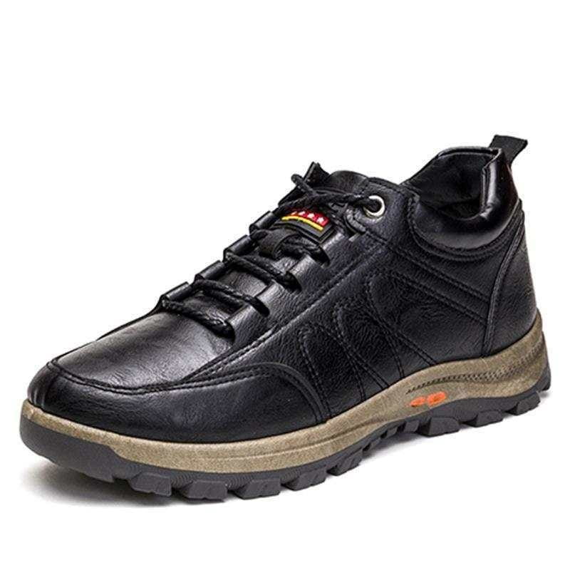 Black leather men’s winter hiking boots with orange accent details and a rugged sole designed for waterproof outdoor use
