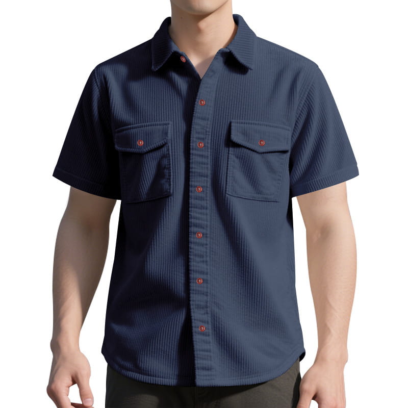 Navy blue loose corduroy short sleeve workwear shirt with red buttons and two chest pockets.