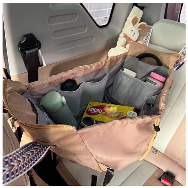 Beige and gray multifunctional waterproof nylon car seat organizer with multiple compartments and patterned strap for tote and backpack use.