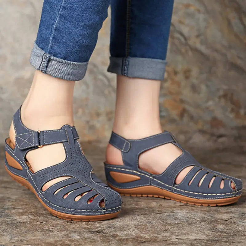 Retro wedge sandals women plus size t-strap shoes featuring blue suede upper with tan rubber soles and decorative stitching.