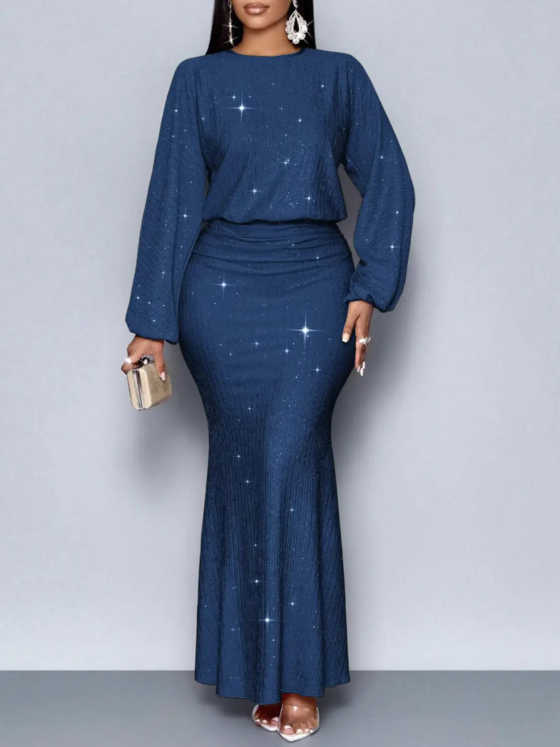 Deep blue sequin lantern sleeve two piece set featuring a star pattern with long sleeves and a fitted mermaid skirt.