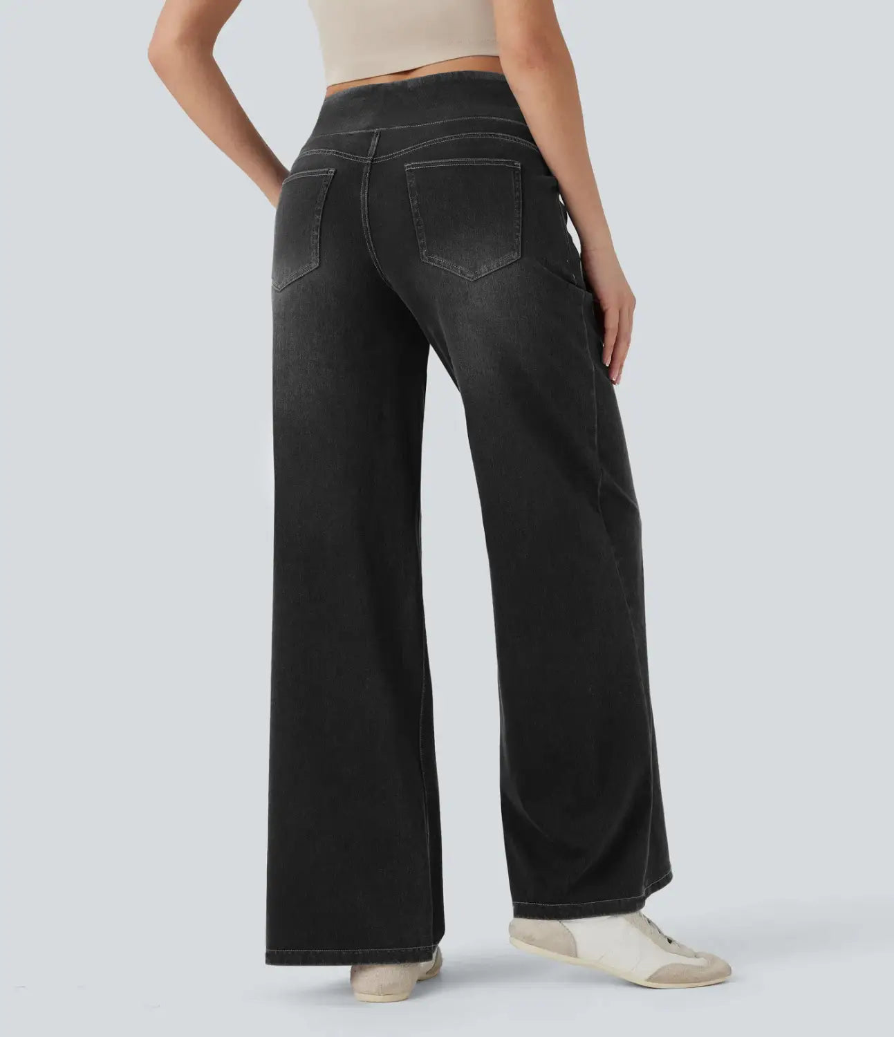 Black wide leg stretchy high waisted denim jeans shown from the back with classic pockets and a comfortable fit.